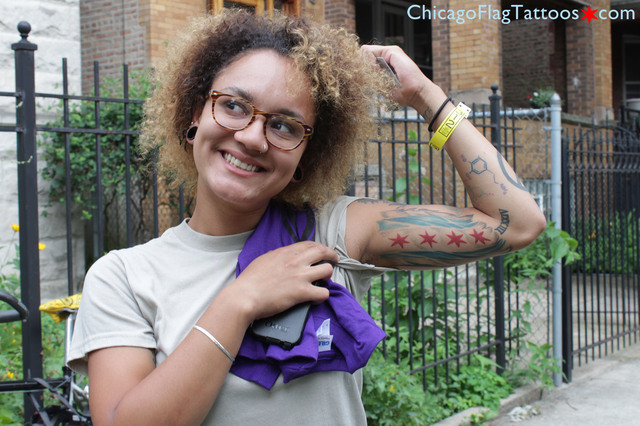 Image of a woman with a Chicago city flag tattoo. 